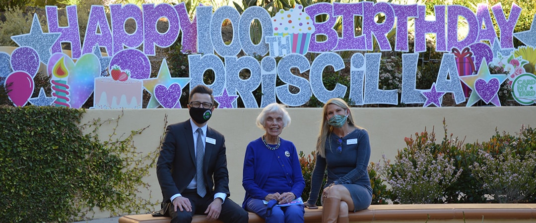 happy birthday message and 3 people sitting